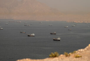 Strait of Hormuz Escort Operations Paused After Commercial Ship Hit in Suspected Attack Near Oman